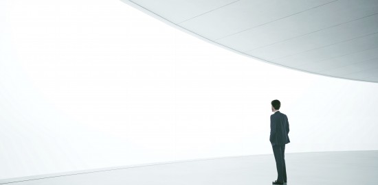 Businessman in front of wide white screen template
