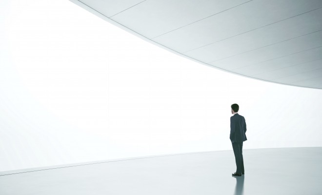 Businessman in front of wide white screen template